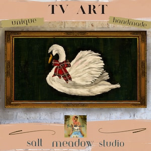 May include: A framed painting of a white swan with a red and black plaid bow on a dark green background. The frame is gold with ornate details. The painting is titled "TV Art" and is handmade and unique.