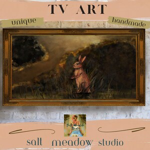 May include: A framed painting of a rabbit in a forest setting. The rabbit is pink and is standing in the middle of the painting. The background is a dark green and brown forest. The frame is gold and has a decorative design. The painting is titled "TV Art" and is handmade and unique.
