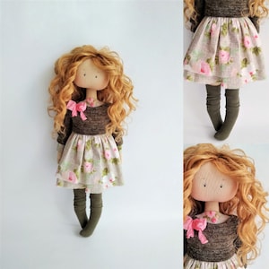 Gift textile doll in a handmade dress. Kids room interior.
