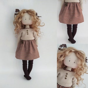 Gift handmade textile collectible doll brown dress.  Interior nursery, living room.