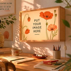 May include: A rectangular wooden lightbox with a floral design featuring orange poppies. The text "PUT YOUR IMAGE HERE" is centered on the light panel. The lightbox is 42 cm x 30 cm and 12 cm deep.