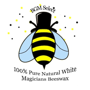 May include: A cartoon bee wearing a top hat with the text "BGM Select" above it. The text below the bee reads "100% Pure Natural White Magicians Beeswax".