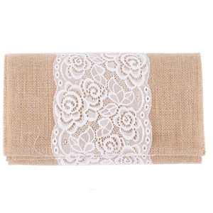 May include: A brown burlap runner with a white lace trim. The lace trim features a floral design.