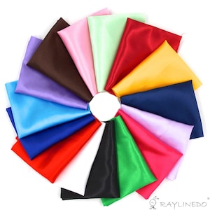 May include: A collection of 15 different colored satin fabric squares arranged in a circle. The colors include red, blue, green, yellow, purple, pink, brown, black, and white.