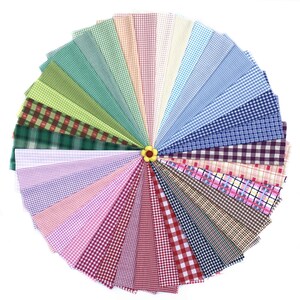 May include: A collection of 30 different gingham fabrics in a variety of colours, arranged in a fan shape.