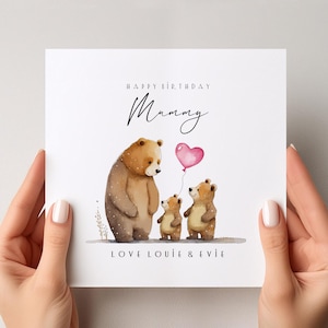 May include: Happy Birthday Mommy card with a watercolor illustration of three brown bears. The mama bear is holding a pink heart balloon and the two cubs are holding smaller pink heart balloons. The card says "Love Loui & Evie" at the bottom.