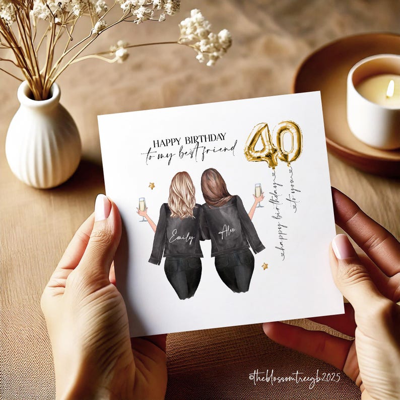 May include: A white card with a gold balloon number 40 and the text "Happy Birthday to my best friend" with two women in black jackets and the names "Emily" and "Alex" on their backs. The text "Happy birthday to you" is written on the right side of the card.