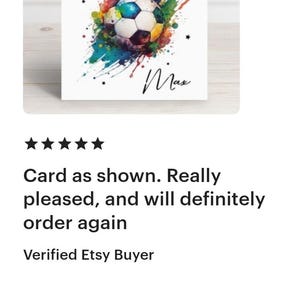 May include: A white card with a colorful watercolor design of a soccer ball. The text "HAPPY BIRTHDAY" is at the top of the card and the name "Max" is written in cursive at the bottom.