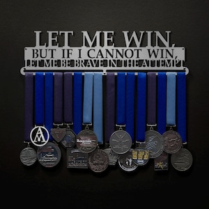 May include: A metal medal display rack with the quote "Let me win, but if I cannot win, let me be brave in the attempt."  The rack is holding a variety of medals with blue and purple ribbons.