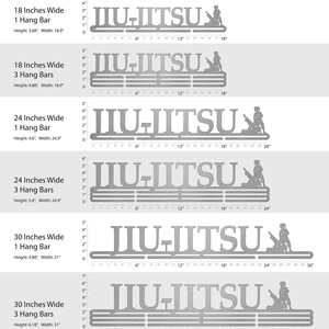 May include: A silver metal Jiu-Jitsu medal display rack with a silhouette of a person practicing Jiu-Jitsu. The rack is available in 18, 24, and 30 inch widths and with 1 or 3 hang bars. The rack is shown with a ruler for size reference.