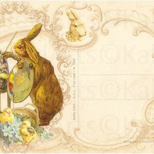 May include: A vintage postcard featuring a brown rabbit painting an Easter egg with a paintbrush. The rabbit is sitting on a stool with a palette of paints. The postcard has a decorative border with floral designs and a rooster in the upper right corner. The text "RIPR. VIET. R.D.L. 7-X1-1925-N 1800" is printed on the right side of the postcard.