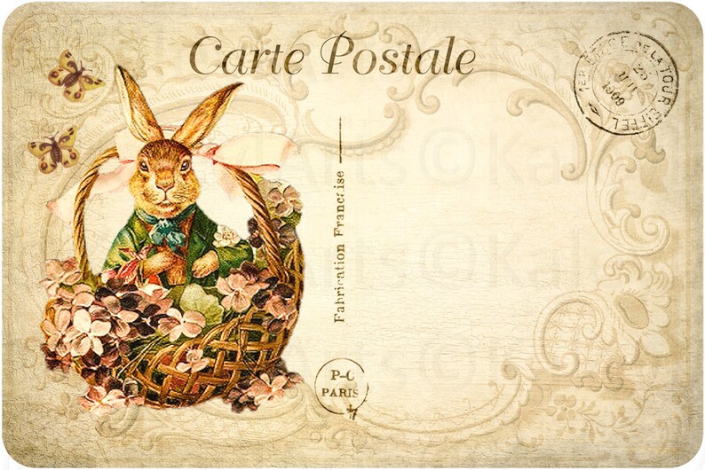 May include: Vintage postcard featuring a brown rabbit wearing a green jacket and a pink bow, sitting in a wicker basket filled with purple and white flowers. The postcard has the text "Carte Postale" and "Fabrication Fran&ccedil;aise" printed on it.