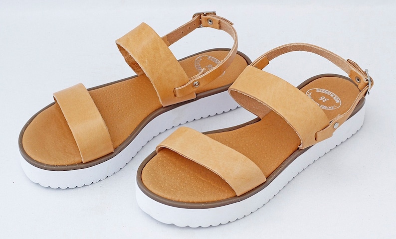 tan sandals with white sole