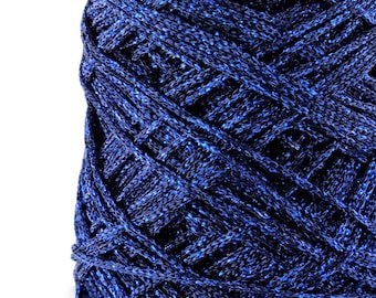 May include: A close-up of a spool of blue yarn with a metallic sheen. The yarn is tightly wound and has a textured surface.