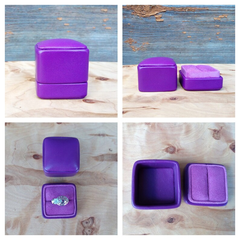May include: A set of four images showcasing a purple ring box. The box is square with a hinged lid and a soft, velvety interior. One image shows the box closed, while others display it open, revealing a ring.