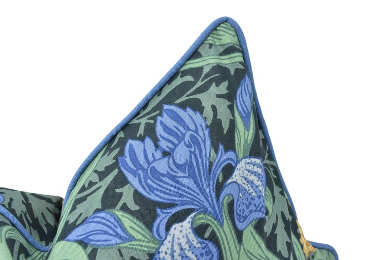 a close up of a tie with blue flowers on it
