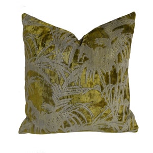 May include: A green velvet pillow with a white palm leaf pattern.