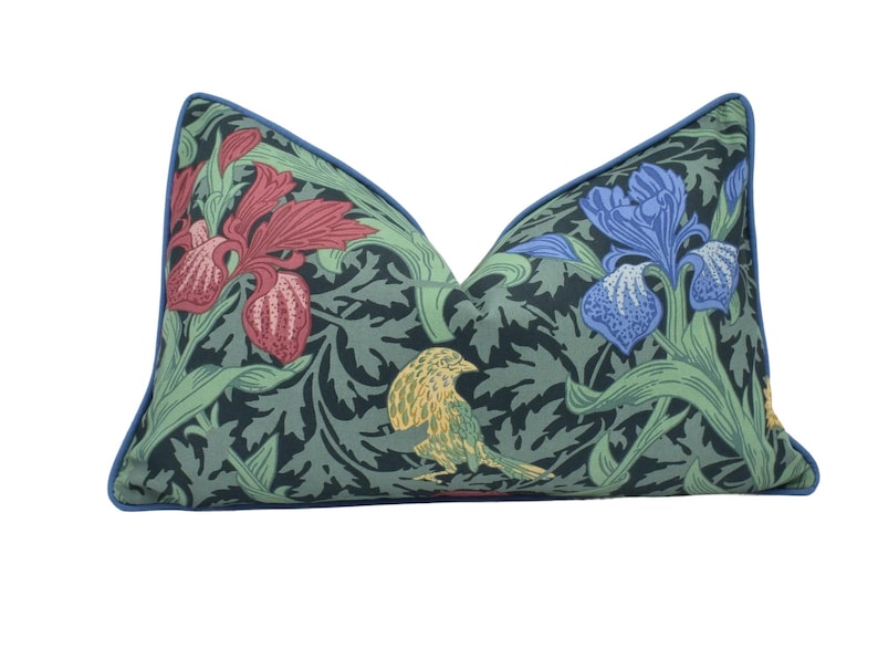a pillow with a bird and flowers on it