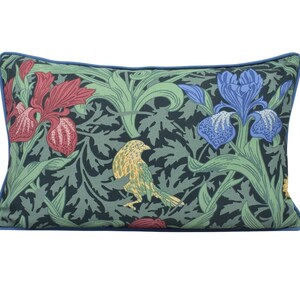 a pillow with a bird and flowers on it