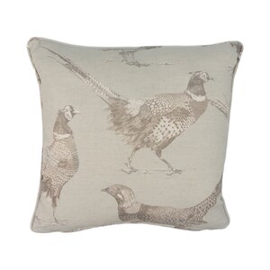 May include: A beige throw pillow with a brown pheasant print. The pillow features a repeating pattern of pheasants in various poses.