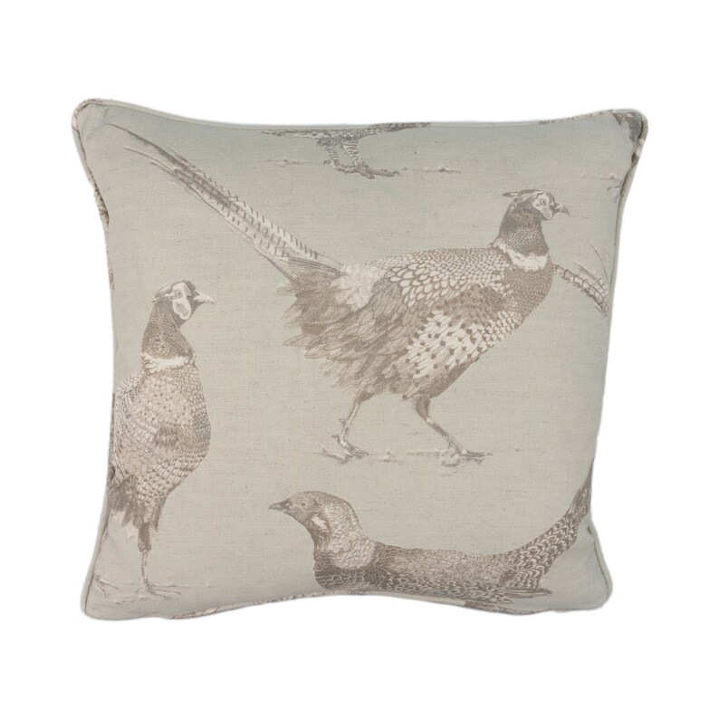 May include: A beige throw pillow with a brown pheasant print. The pillow features a repeating pattern of pheasants in various poses.
