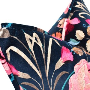 a close up of a tie with flowers on it