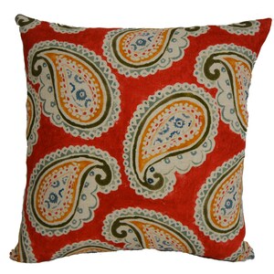 May include: Red throw pillow with a paisley pattern in shades of green, blue, and yellow.