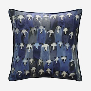 May include: A blue throw pillow with a pattern of many blue and white bears. The bears are all facing forward and have a simple, cartoon-like design.