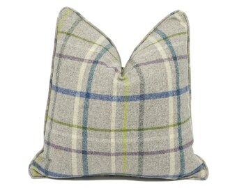 May include: A gray plaid throw pillow with blue, green, and purple stripes. The pillow is made of a soft, textured fabric.