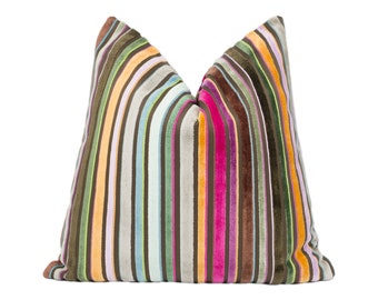 May include: A colorful striped pillow with a brown background and stripes of pink, orange, green, blue, and purple.