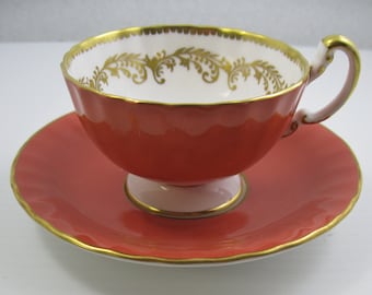 Aynsley Cup and Saucer  Orange Color with  Gold Decorated Interior Trim. Porcelain  Made in England