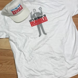 ヴィンテージのレッツ ゲット レディ トゥ ランブル T シャツと帽子 サイズ XL