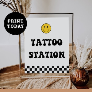 May include: A printable sign with a black and white checkered border. The sign says "Tattoo Station" in a retro font with a yellow smiley face with lightning bolts for eyes above the text.