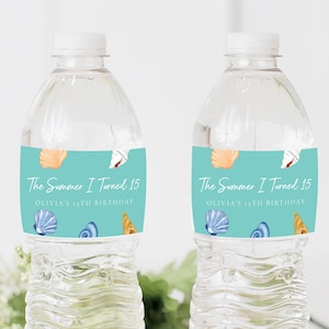 May include: Two clear plastic water bottles with turquoise labels that say "The Summer I Turned 15" and "Olivia's 15th Birthday". The labels have illustrations of seashells.