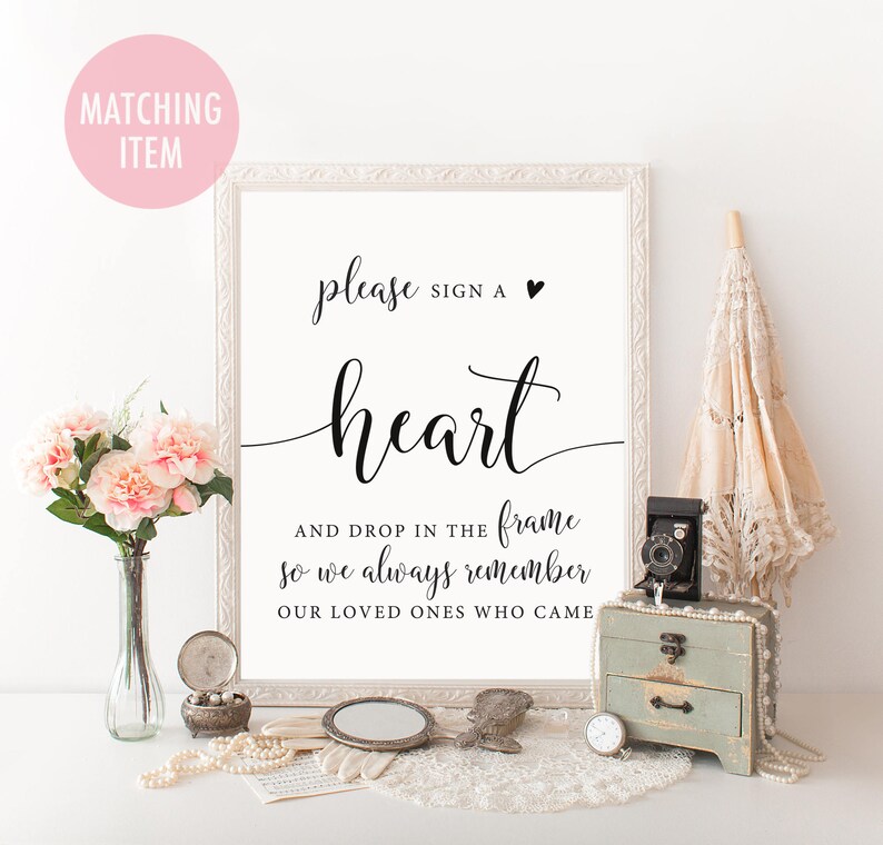 Puede incluir: Un cartel blanco con texto negro que dice "please sign a heart and drop in the frame so we always remember our loved ones who came".