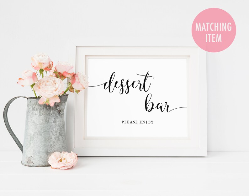May include: White framed sign with black calligraphy that reads "dessert bar" and "please enjoy".
