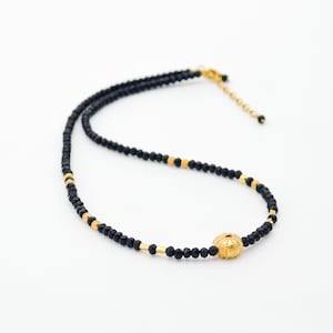 Black spinel with gold sea urchin necklace. Maritime jewelry, Sea shell necklace. Designer jewelry
