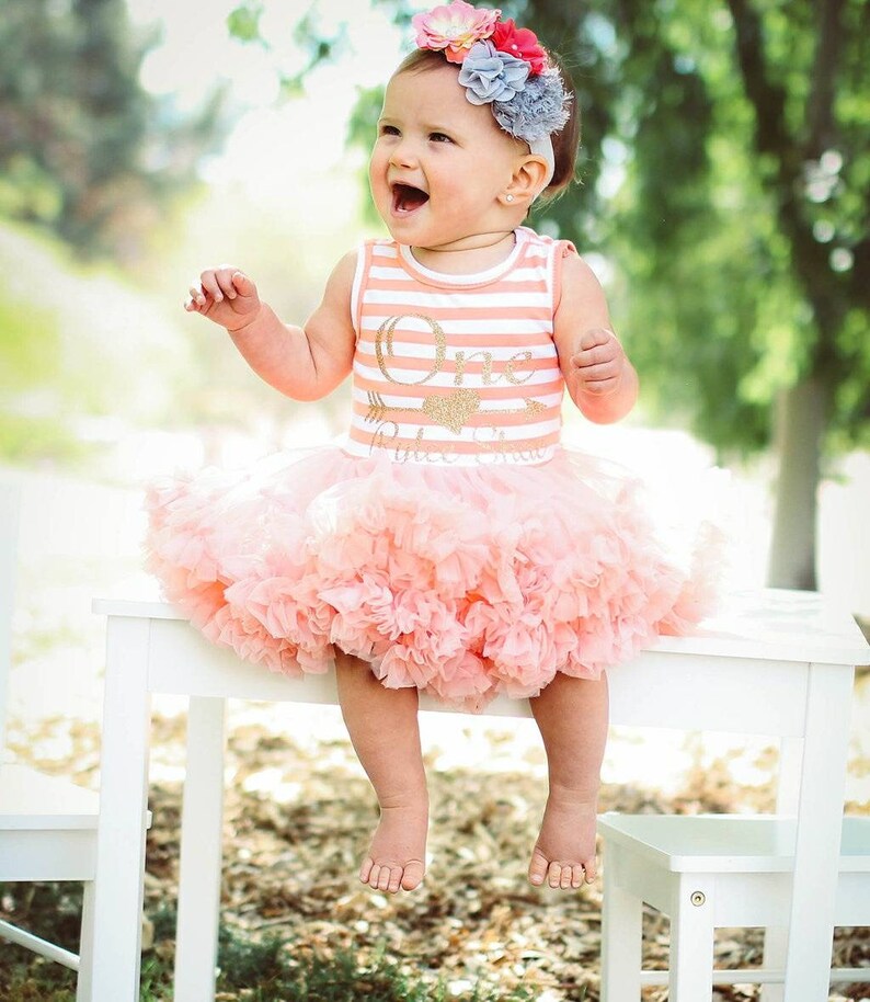peach and gold outfit