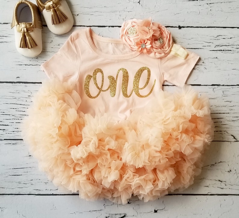 peach and gold outfit