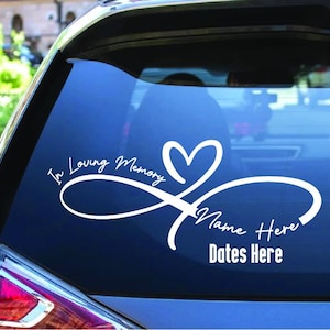 May include: White vinyl car decal with an infinity symbol and a heart. The text reads "In Loving Memory" and has space for a name and dates.