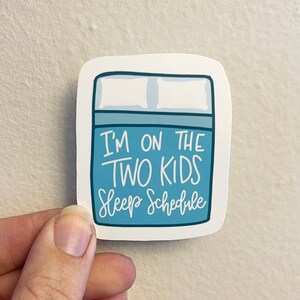 Two Kids Sleep Schedule Glossy Vinyl Sticker