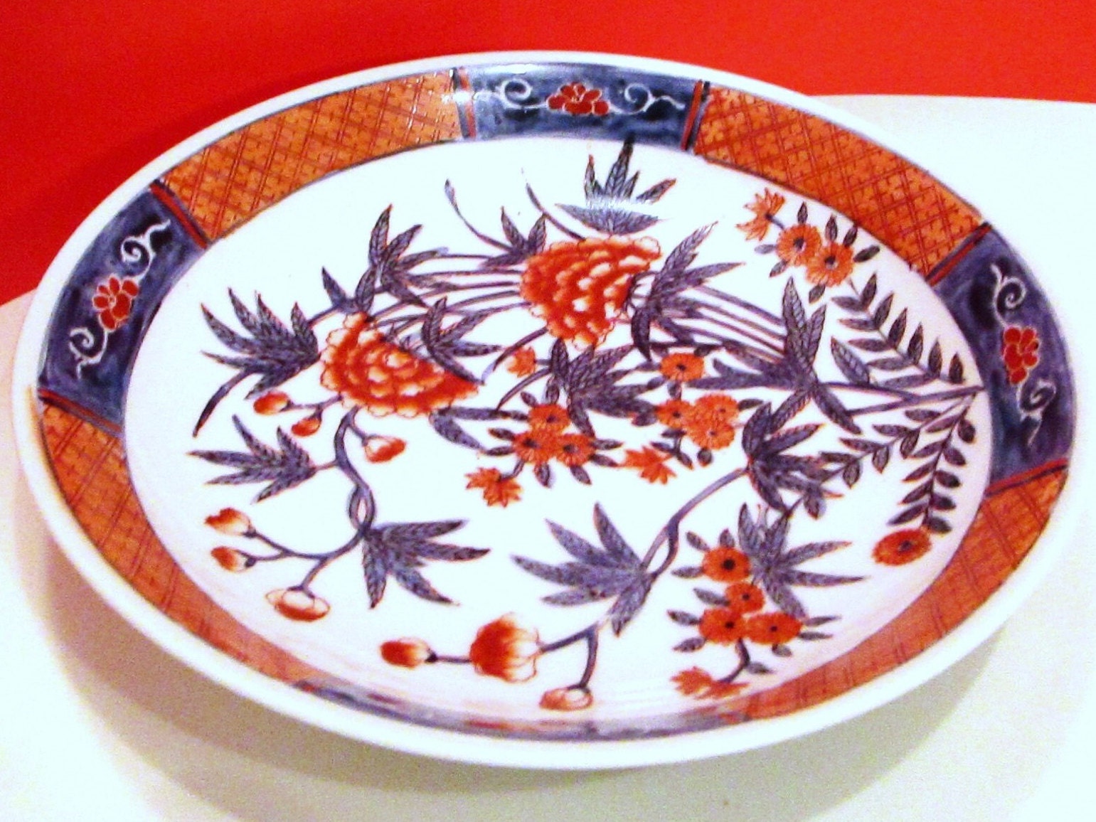 手彩入り日本製磁器ボウル：オレンジとブルーの花模様 - Etsy 日本