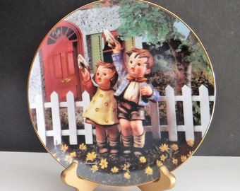 Plato Hummel "Vuelve pronto": Little Companions, 1992, con borde de oro de 23 quilates.