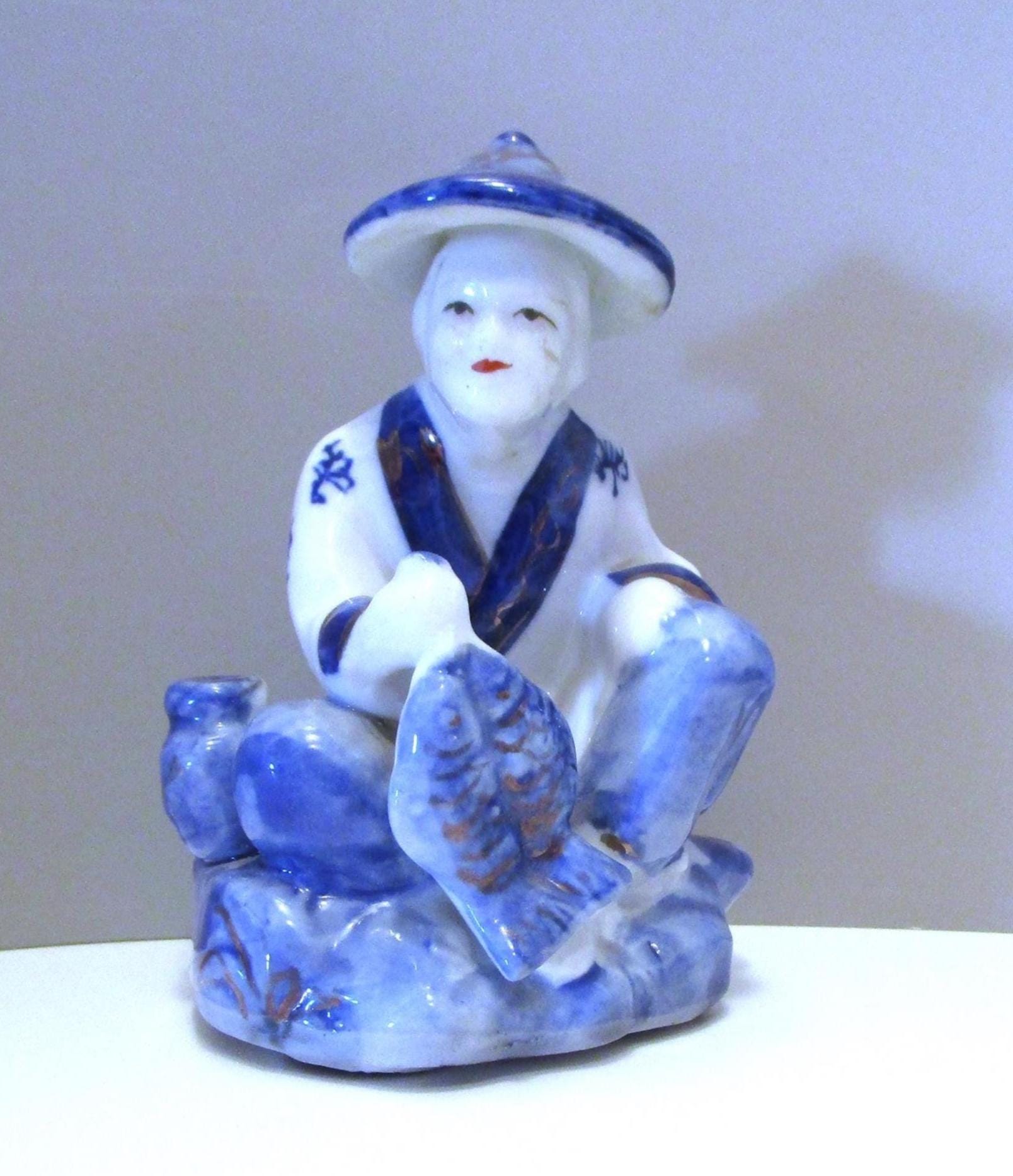 Vintage 1980 Porcelain Asian Fisherman Figurine in Cream and Tan - Unbranded main image 2