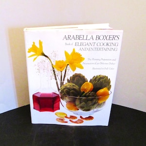 May include: A rustic wooden sign with the text "Welcome to our home" in white lettering. The sign features a distressed finish and a simple, inviting design, perfect for front door decor.