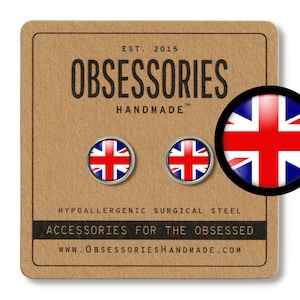 May include: A pair of hypoallergenic surgical steel earrings featuring a round, silver-colored stud with a Union Jack flag design. The earrings are displayed on a brown card with the text "OBSESSORIES HANDMADE" and "ACCESSORIES FOR THE OBSESSED".