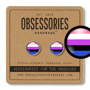 May include: A pair of hypoallergenic surgical steel earrings featuring a pink, white, purple, black, and blue genderqueer pride flag design. The earrings are displayed on a brown card with the text "OBSESSORIES HANDMADE" and "ACCESSORIES FOR THE OBSESSED".