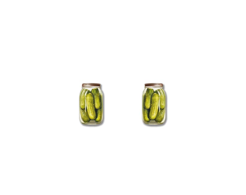 May include: Two glass jars filled with green pickles. Each jar has a metal lid and is filled with several whole pickles. The jars are set against a white background.