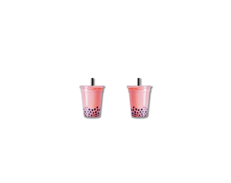 May include: Two clear plastic cups filled with pink bubble tea, each with a black straw. The tea contains dark purple tapioca pearls. The cups are set against a white background.
