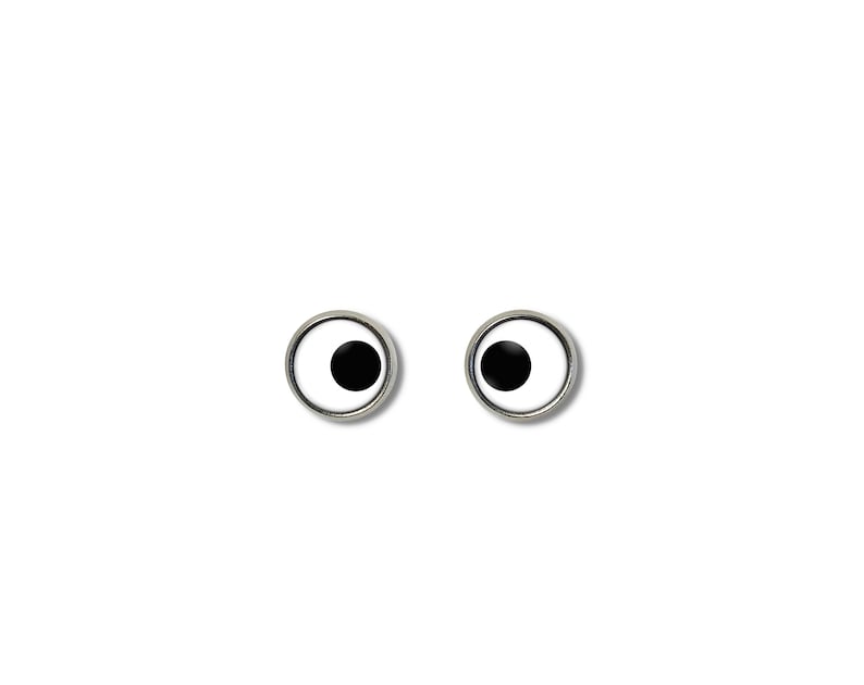 May include: Two googly eyes with black pupils and white irises, set against a white background.